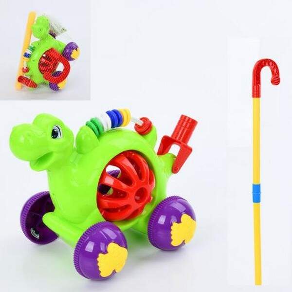 Каталка A0513 (36шт) динозавр 20см, на палиці 53см, брязкальце, в сітці, 26-17-16см (шт.)